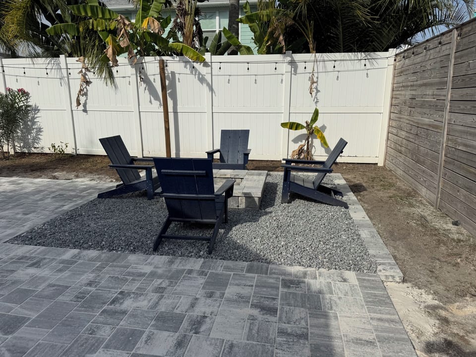 firepit with 4 adirondack chairs
