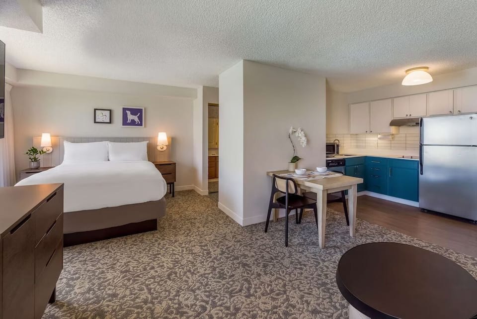 Settle into a spacious bedroom with convenient kitchenette nearby