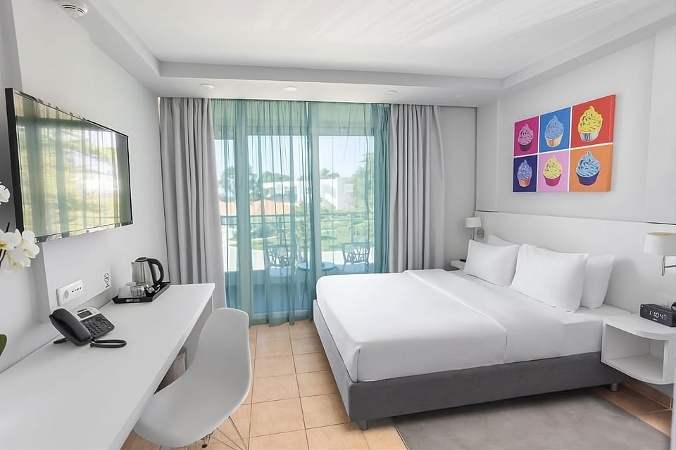 Unwind in a bright king room with balcony views.