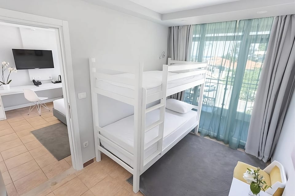 Spread out comfortably with bunks and a bright balcony outlook.