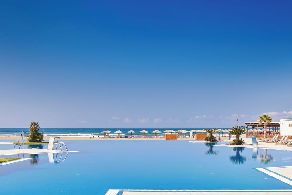 Float peacefully in the infinity pool facing endless blue seas.