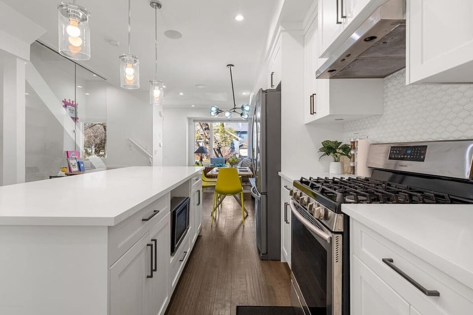 Contemporary kitchen with sleek finishes, full-size appliances, and generous prep space.