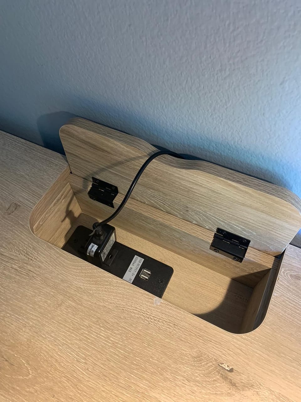Large desk with built-in outlet and USB ports. Don't crawl around to plug in