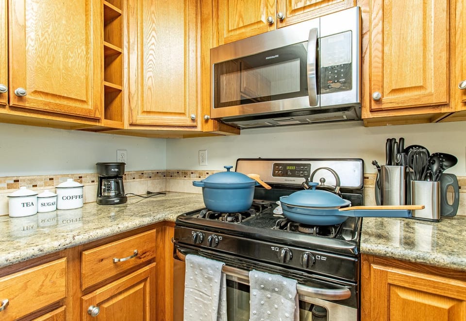 New, stainless steel appliances and granite countertops for enjoying home meals