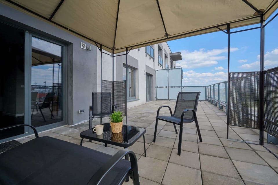 The terrace provides a perfect spot for enjoying the fresh air. 
