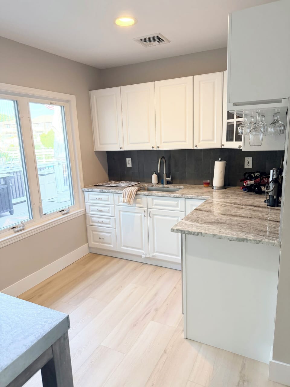 Wet Bar - newgranite countertop, backsplash, and sink/faucet with wine refridge