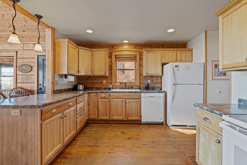 Open kitchen with seating at the island.