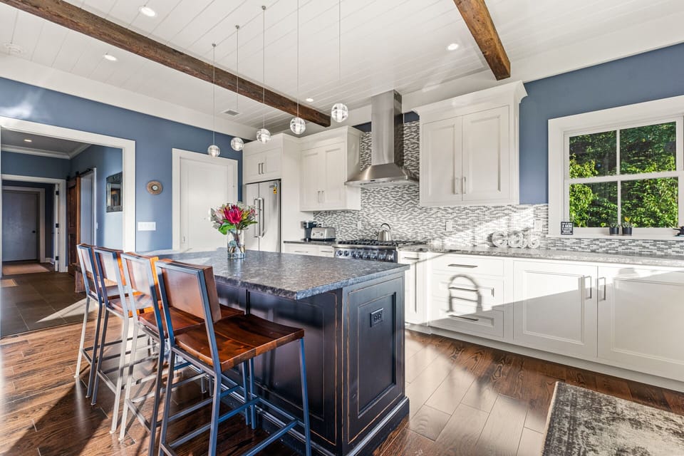 This home has an open-concept gourmet kitchen with top-of-the-line appliances