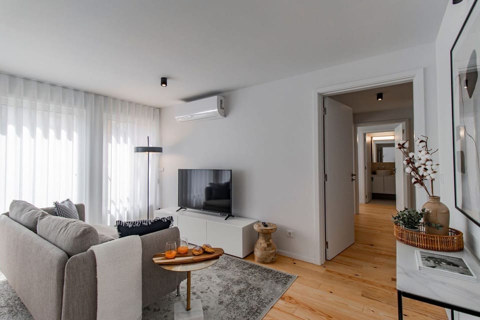 The combination of sleek design elements and the influx of sunlight creates a contemporary and inviting living area #airbnbporto #wonderful