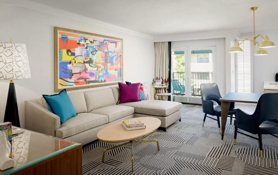 Unwind on the plush sectional beneath bold, gallery-worthy art.