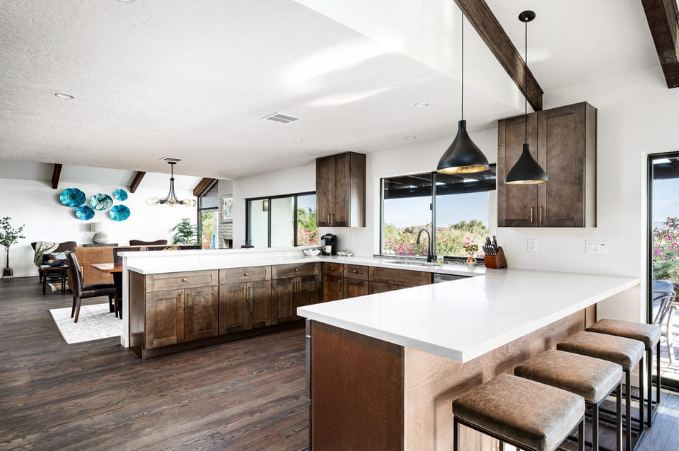 Discover culinary elegance, featuring a spacious open kitchen with modern finishes, natural light, and stunning views—ideal for gathering and entertaining