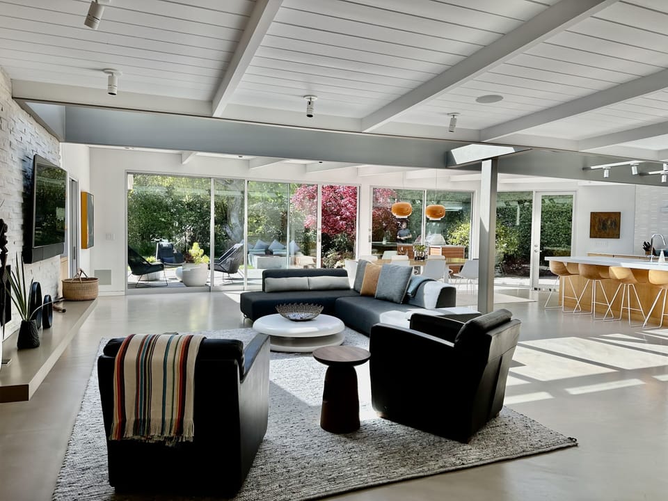 Open concept living area flooded  w/ natural light & fine  indoor outdoor living