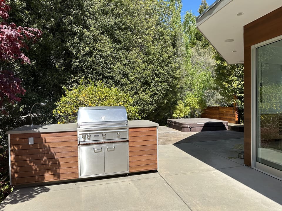 Step out to patio with outdoor barbecue, fire pit and soak in hot tub