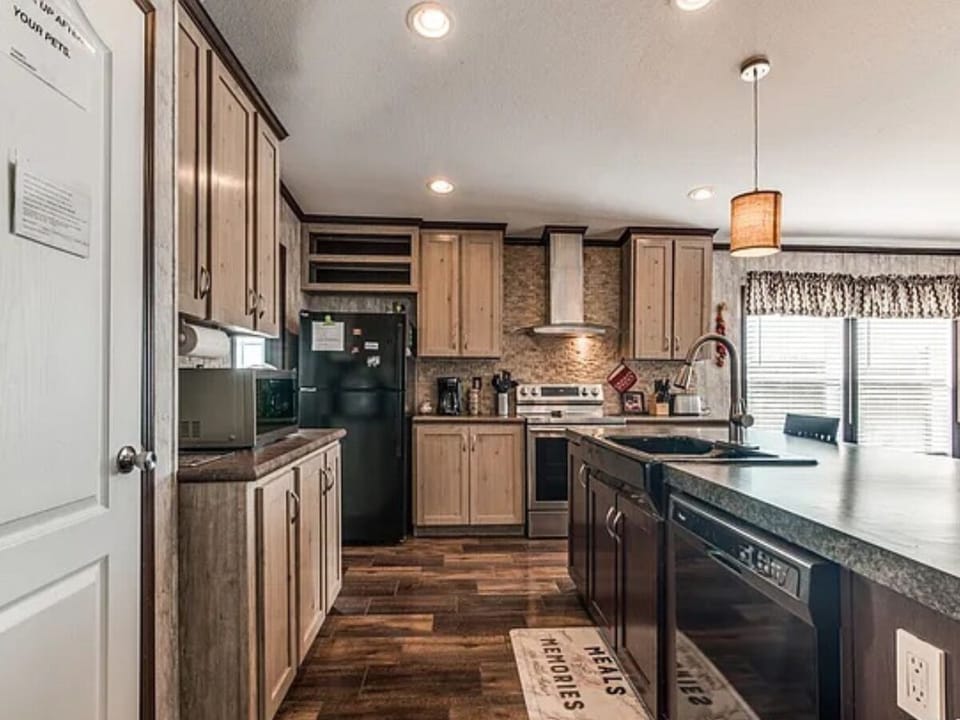 Fridge, freezer, stove, oven, microwave, toaster, coffee maker, and dish washer.