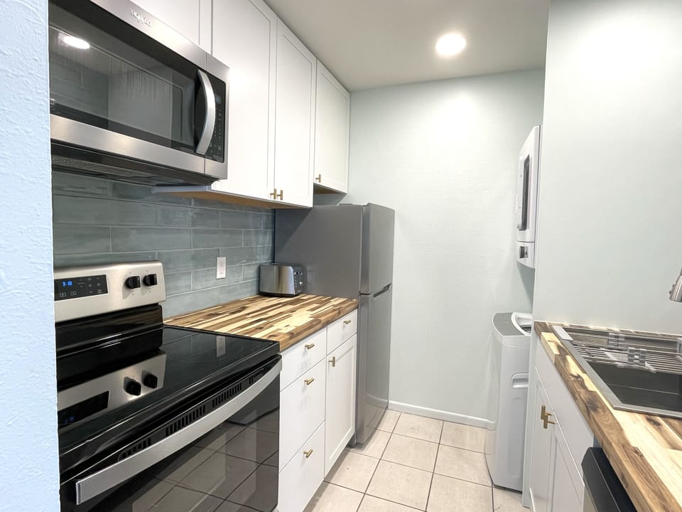 Kitchen, fully stocked with pots/pans, dishes, utensils
