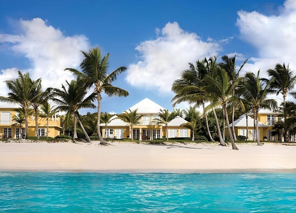 Step onto powdery sand with palms and ocean views.
