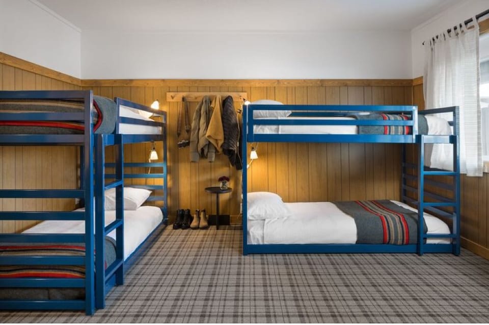 Gather your crew in spacious bunks with reading lights.