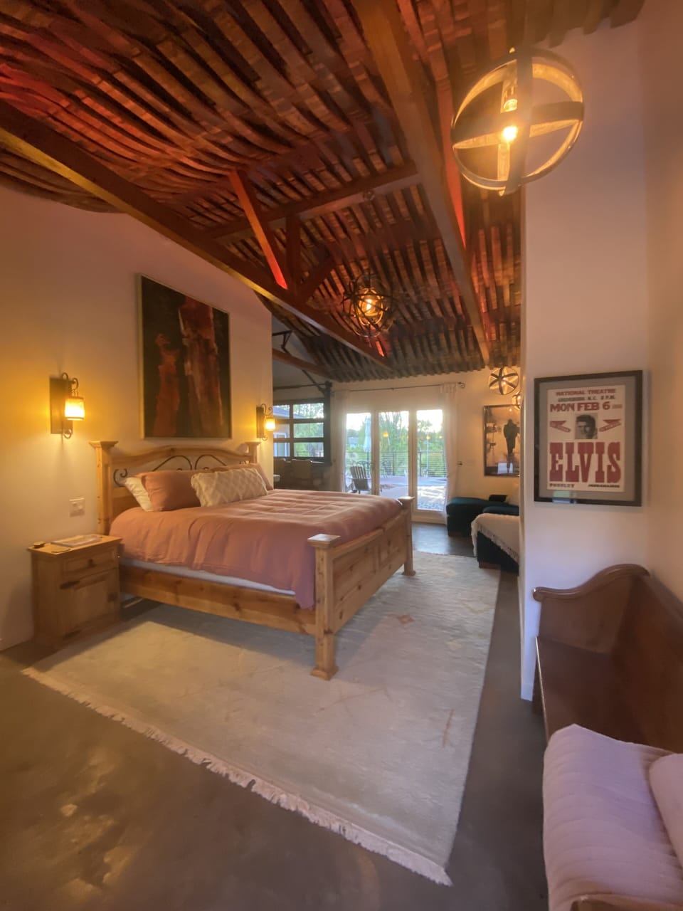 Barrel stave handcrafted ceiling with mood lighting & wine barrel metal pendants