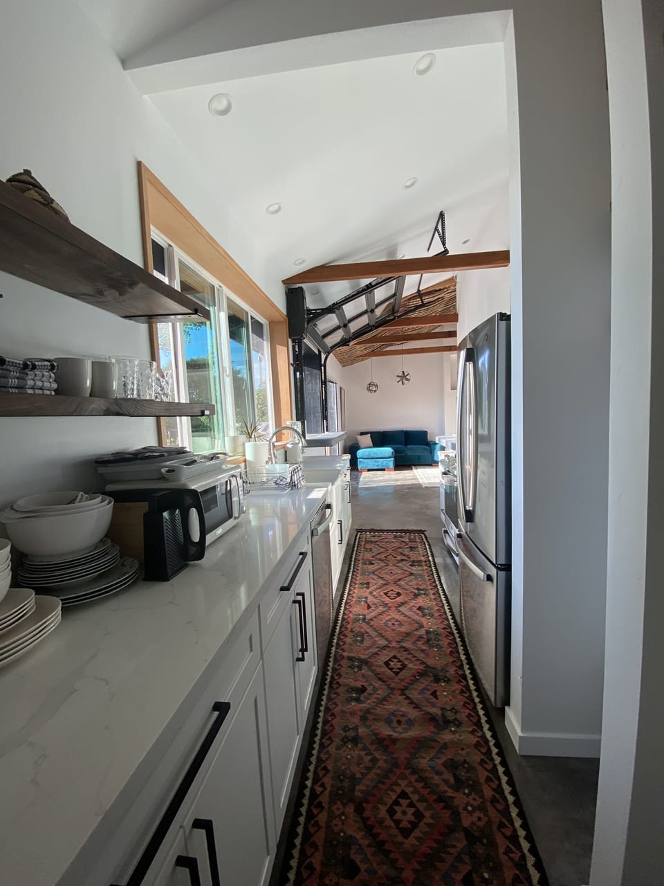 Turkish runner, view from bathroom of galley kitchen.  Well stocked for cooks.