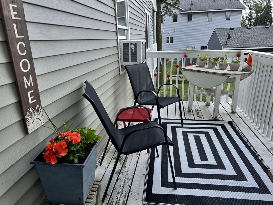 South facing deck that greets you upon arrival.  Fresh grown herbs to enjoy!