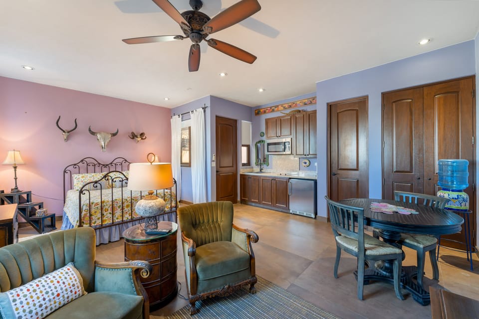 Bedroom 2 with TV, mini kitchen, undercounter fridge and private bath