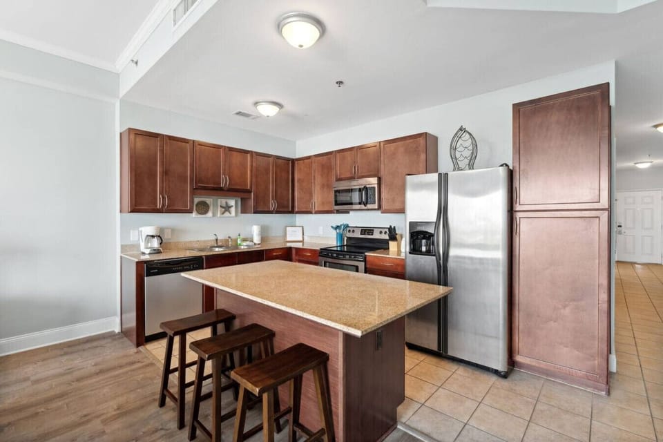 Fully stocked kitchen with island with seating for 3