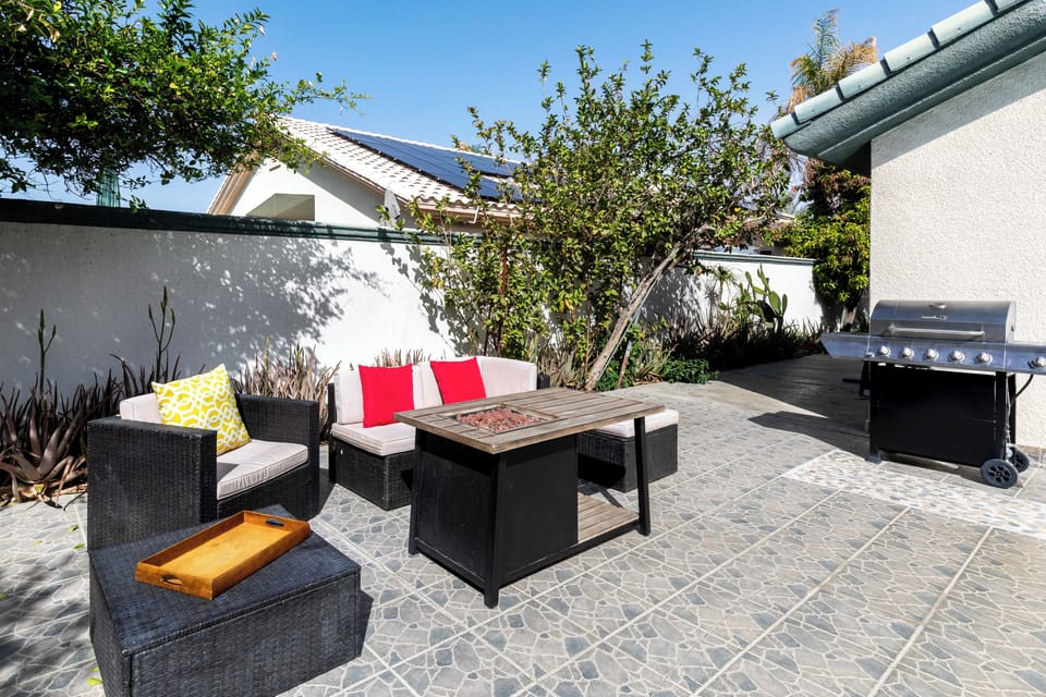 Outdoor seating with propane fire pit and propane grill