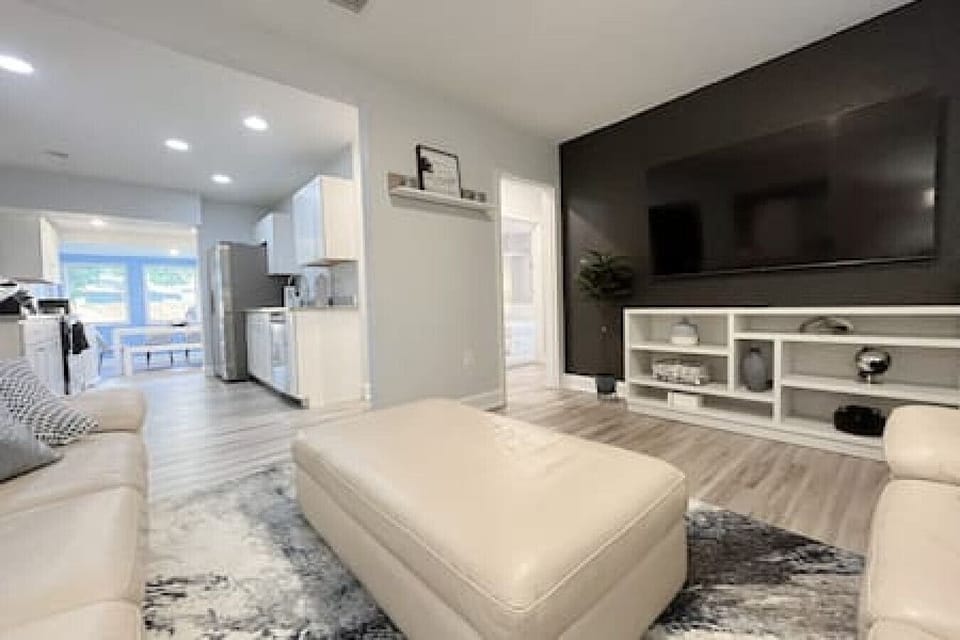 Super, Large Living Space w/ Smart TV, Bright Ceiling Lighting, Comfy Sofa & Ottoman