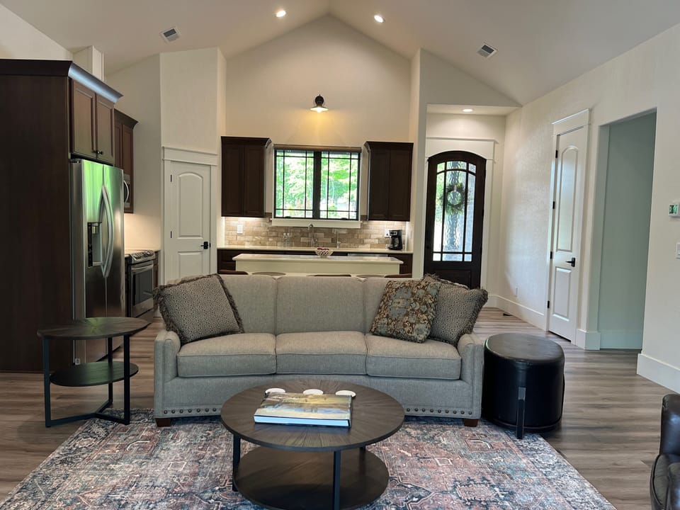 Open living and kitchen with vaulted cielings.  View from back of the Cottage.