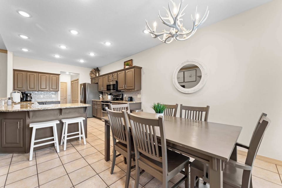 The dining room table is right next to the kitchen!