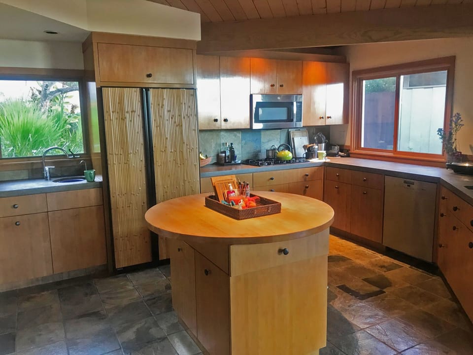Bamboo cabinetry, concrete countertops, slate floors, new appliances. 