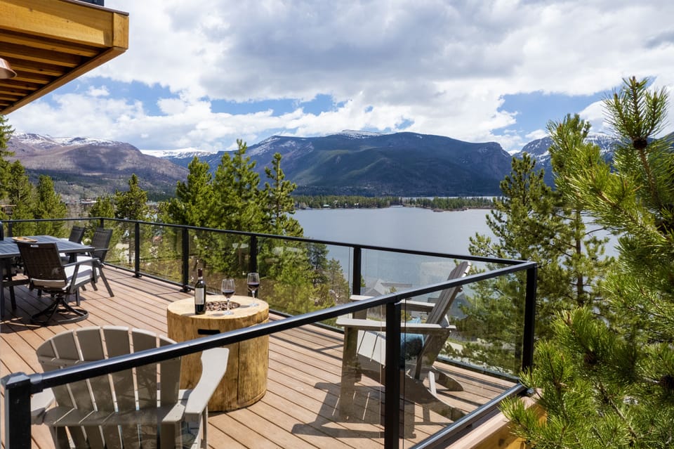 Enjoy breathtaking panoramic views from the deck, complete with a cozy gas fireplace..