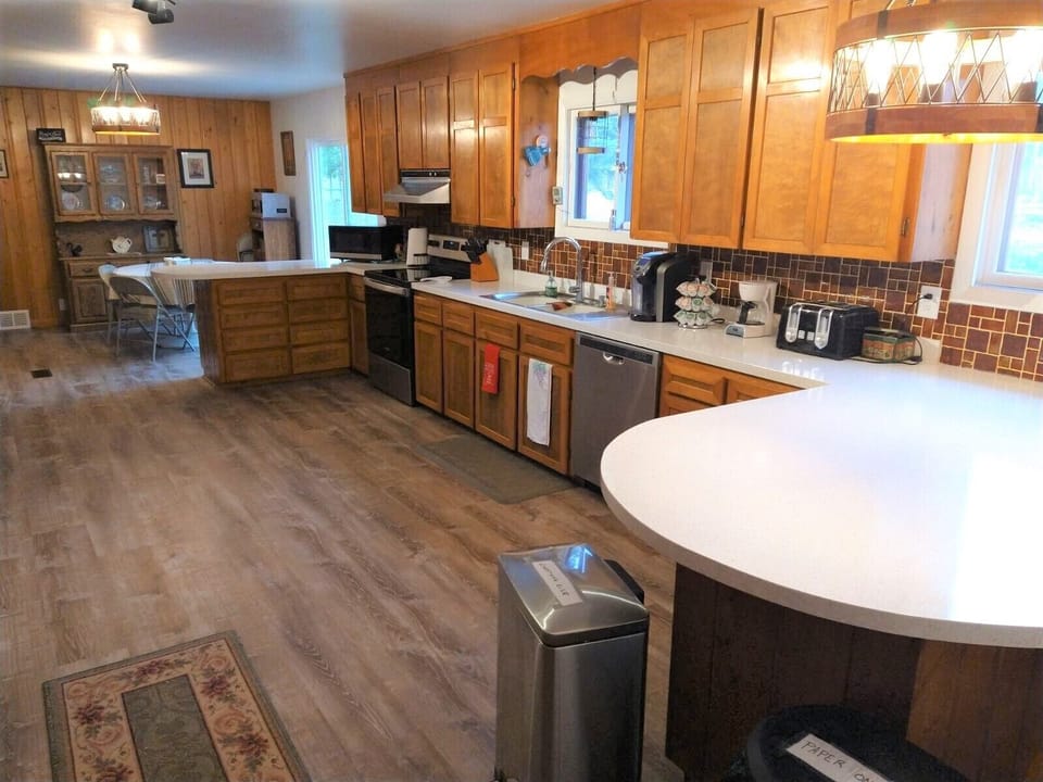 The fully-equipped kitchen boasts new appliances and ample counter space.  