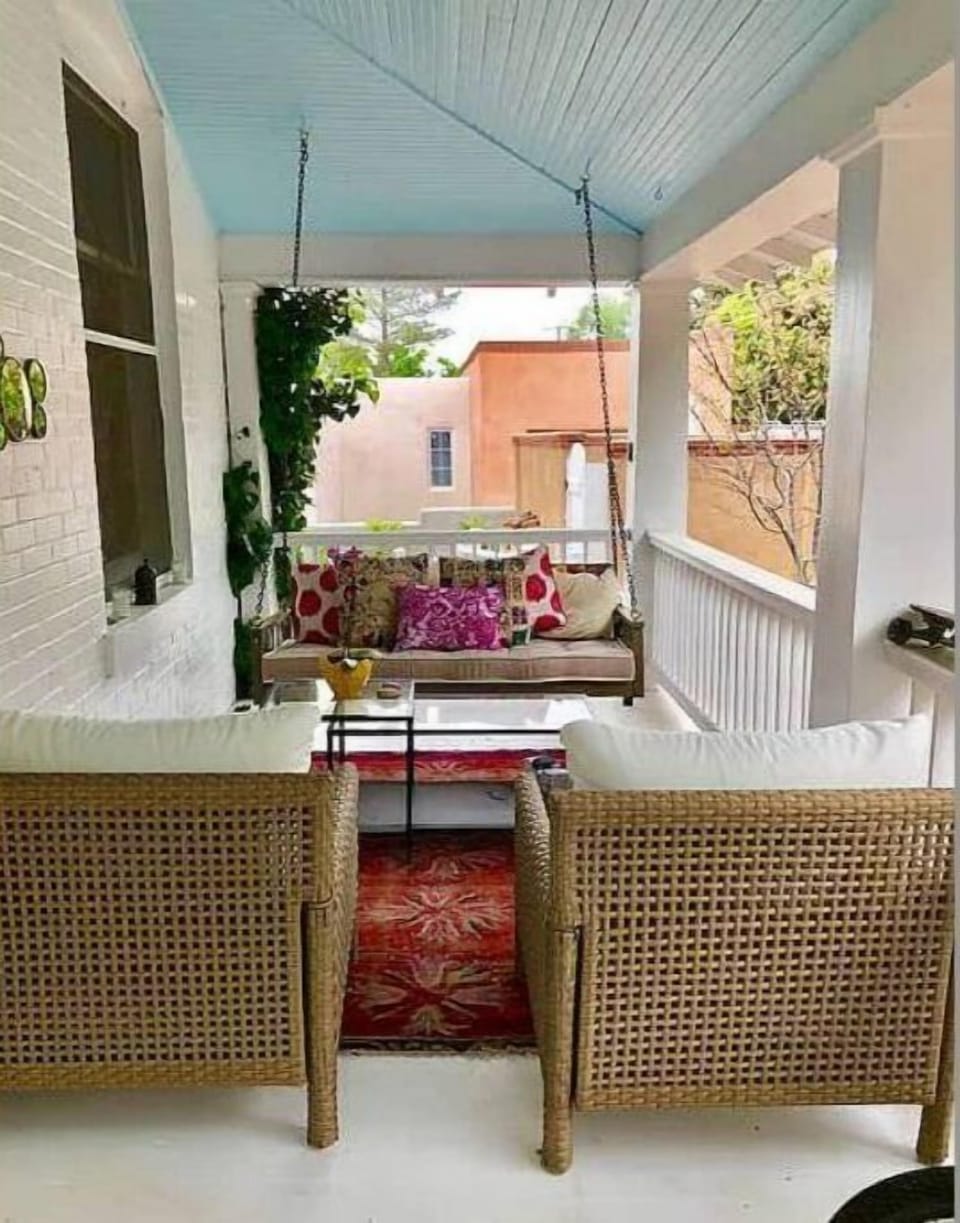 Gorgeous and relaxing front porch with beautiful views of the trees and garden