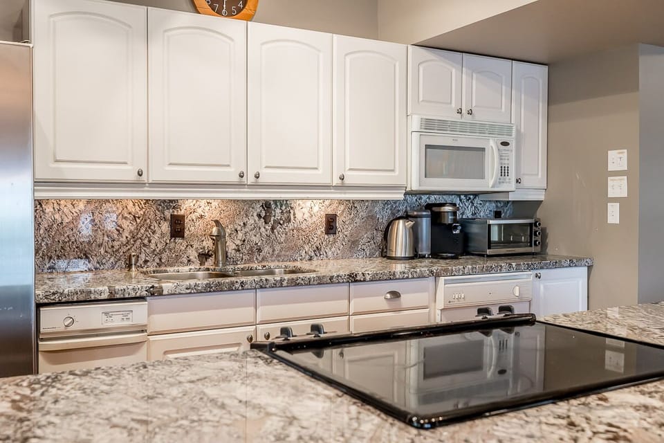 Kitchen with toaster, microwave, Keurig coffee and pods