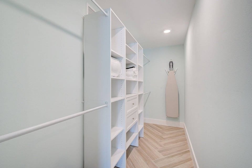 Spacious custom walk in closet in Master Bedroom