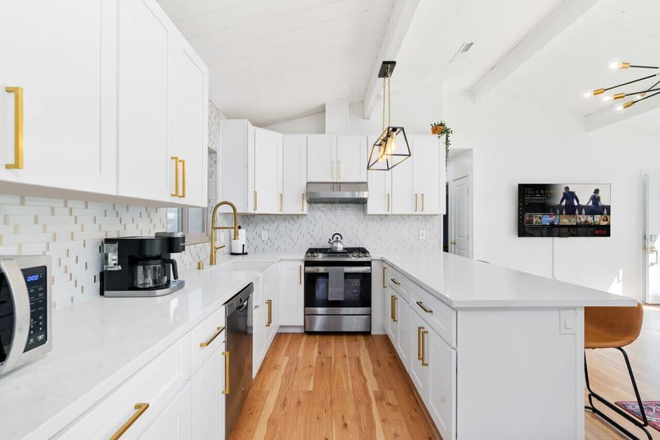 Fully stocked kitchen with island table seating for 4.