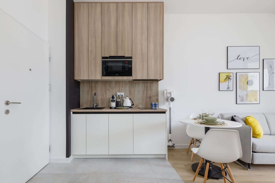 Another perspective of the living room, showing the open-plan layout leading to the dining and kitchen area.