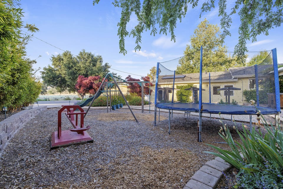 Rear yard and play area of the Verano main house, a great spot f