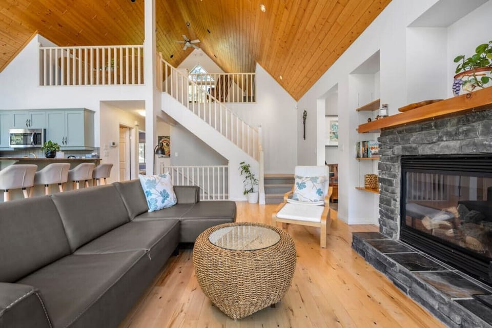 Main floor common area with a gas-lit fireplace.