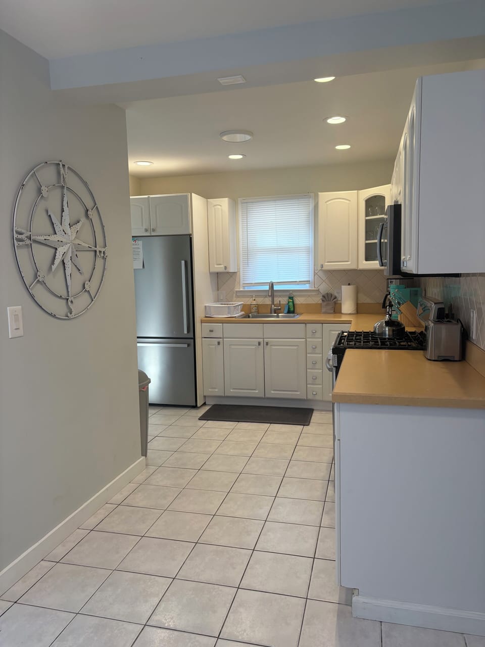 Fully equipped kitchen with stainless steel appliances,