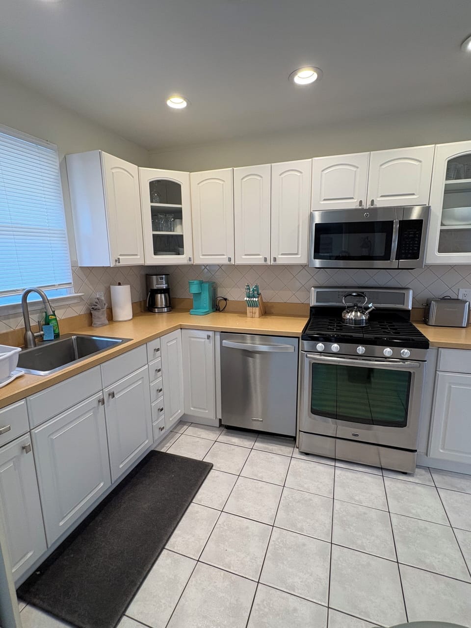 Fully equipped kitchen with stainless steel appliances,