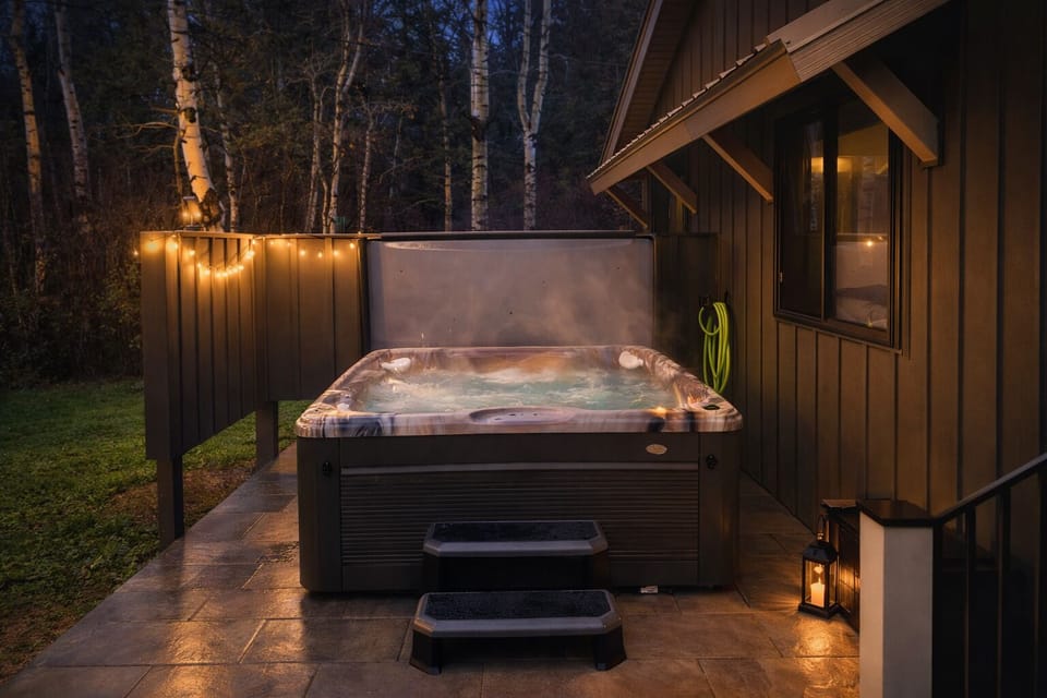 Six person hot tub with lounge chair.