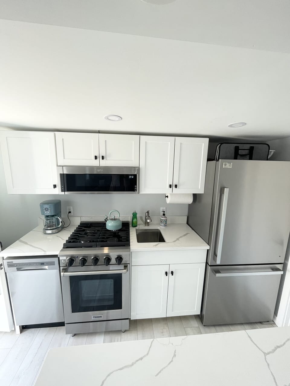 Fully equipped kitchen with stainless steel appliances 