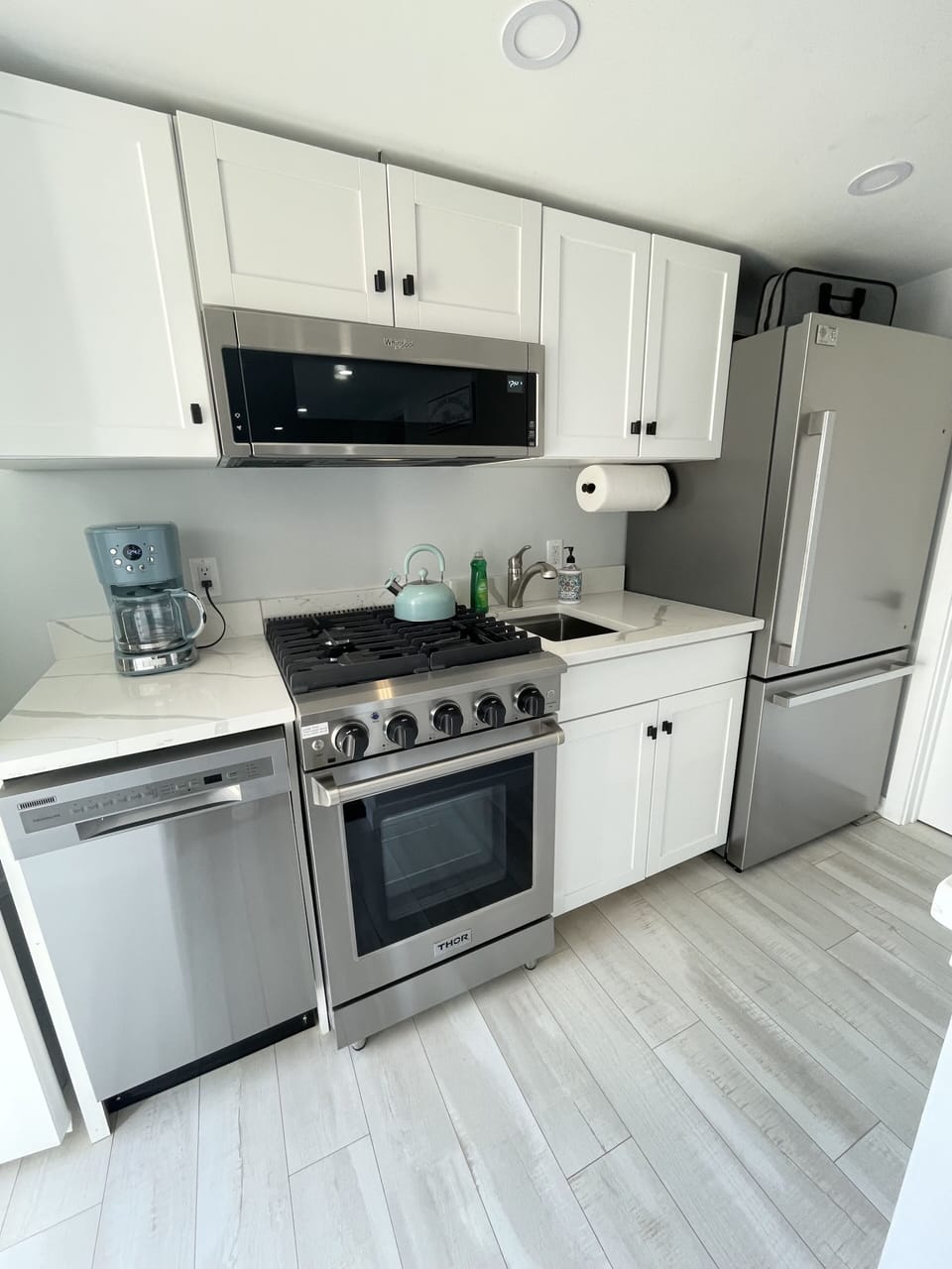 Fully equipped kitchen with stainless steel appliances 
