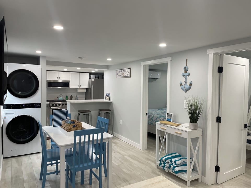 Dining room table for 4. Front end loader washer and dryer