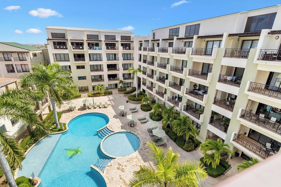 Dive into paradise at our Palm Aruba Condo with a pool. Where every day is a pool day in tropical bliss!