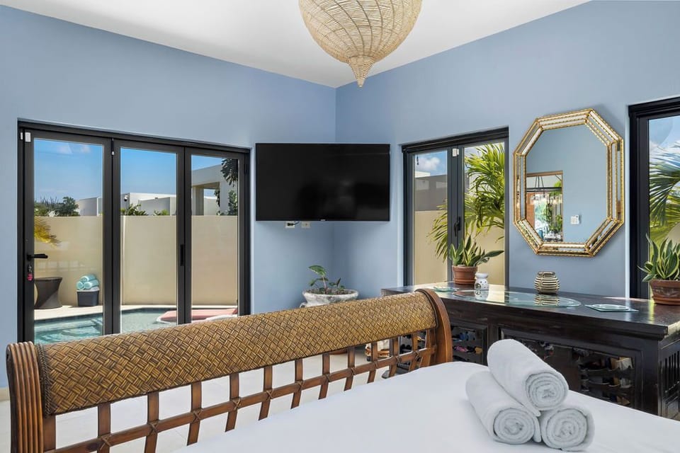 The home boasts two spacious bedrooms, each furnished with comfortable queen beds. Both bedrooms have ensuite bathrooms for added convenience, ensuring privacy and comfort for all guests.
