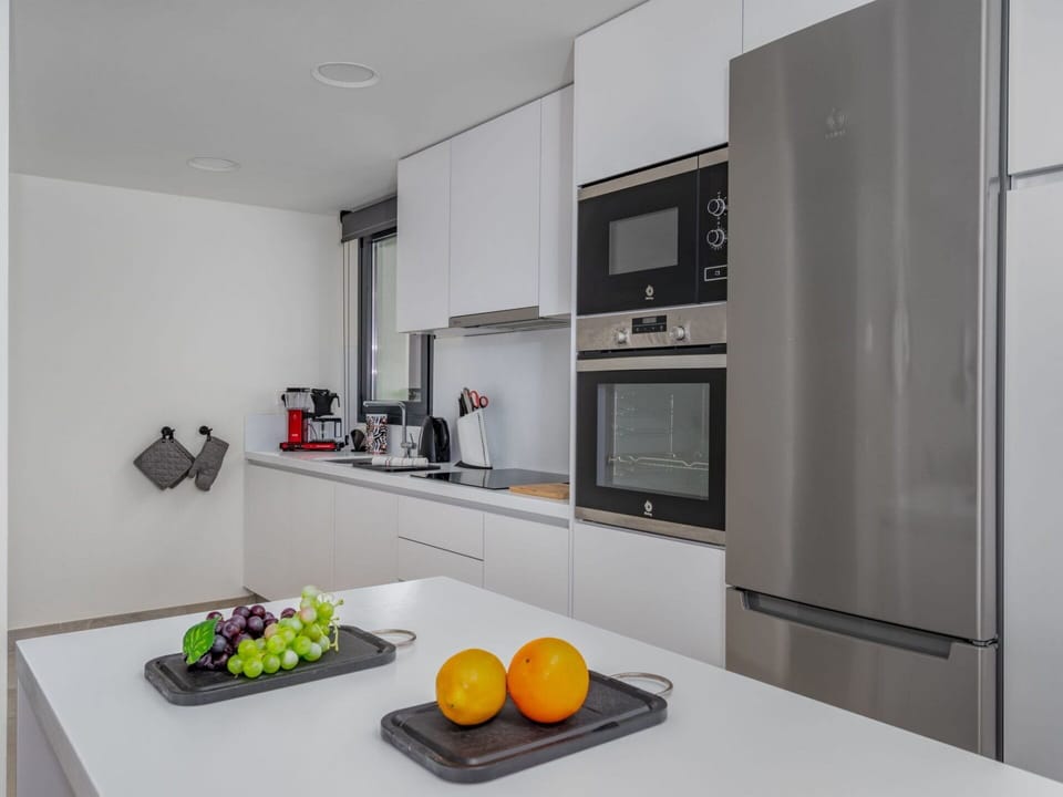 Food, Property, Cabinetry, Tableware, Table, Interior Design, Orange, Architecture, Home Appliance, Floor