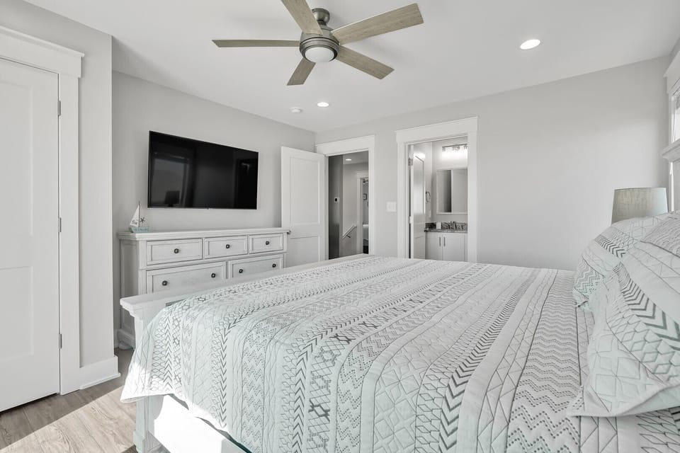 White and Black King bed with TV and Dresser
CG 2.2023